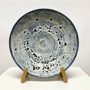 Otto & Gertrude Natzler Volcanic Glazed Low Bowl, Circa 1960s: Absolutely stunning low bowl with a light blue volcanic glaze by husband and wife artists, Gertrude and Otto Natzler, circa 1960s. The Natzlers pioneered the volcanic glaze during the 50's and 60's, a