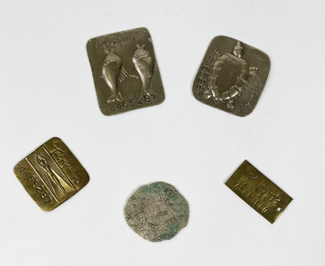 5 Pal Kepenyes Metal Tags: 5 metal tags in brass and silver with imagery of two fish, turtle and a human figure with two stamped Acapulco, sizes 2" x 2.5" to 2" x 1". Purchased directly from the artist in Acapulco in 1966 by th