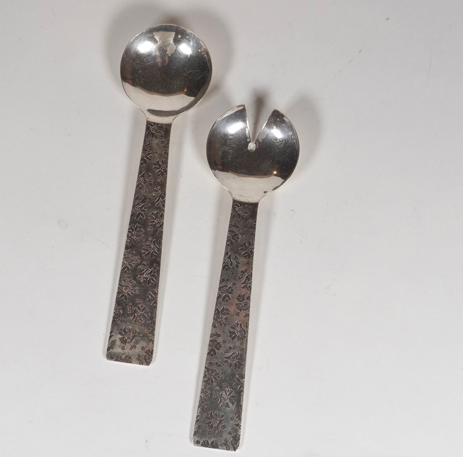 Michael Graves for Reed & Barton / Swid Powell Silver Plate Salad Tongs: Salad tongs designed by Micheal Graves for Reed & Barton / Swid Powell, silver plate marked on the back of each tong, 10.75" L x 3" W.