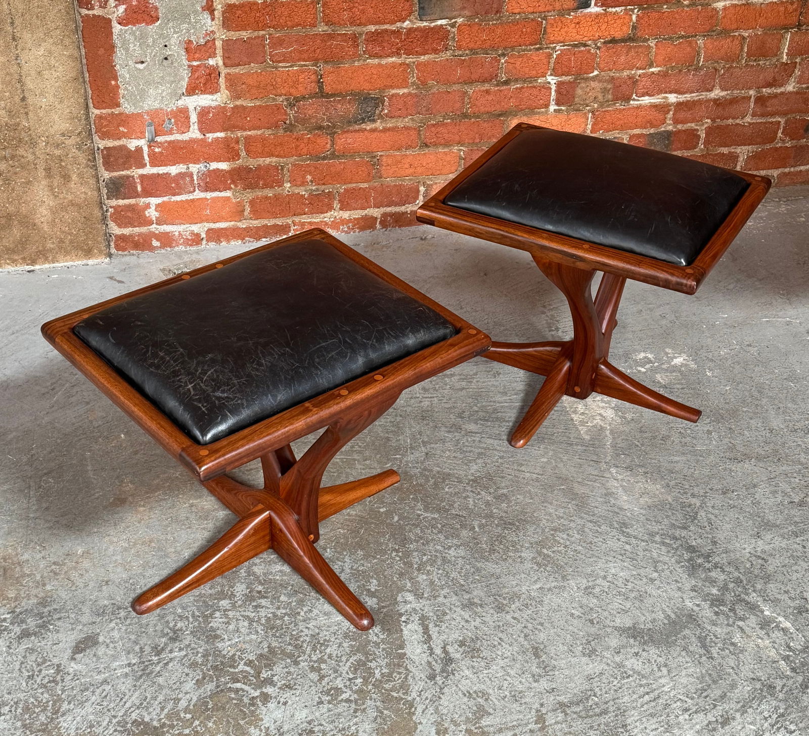 Pair of 1970s California Studio Craft Stools Bay Area Woodworker: 2 walnut and black leather stools done in the 1970s Northen California Bolinas Area Craft Movement / Organic Modern style created by such notable wood crafters as Arthur Espenet Carpenter and JB Blunk