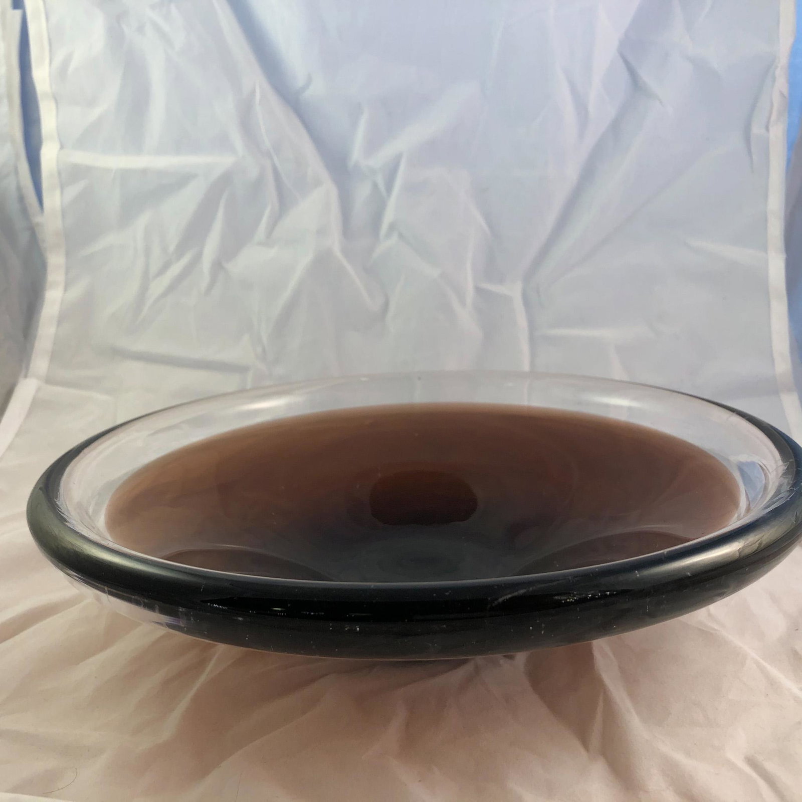 Hand Blown Glass Dish: Hand Blown Glass Dish in a medium brown and clear. Unsigned. Measures 9'D x 2.5" H