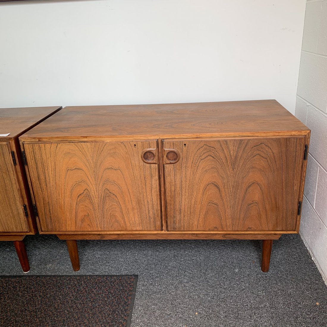 Rosewood 2 Dr, Credenza, Denmark: Rosewood 2 Dr, Credenza, Denmark, in its original finish possibly a lower cabinet for a larger system on tapered legs Measures 39.5" x 20" x 24"