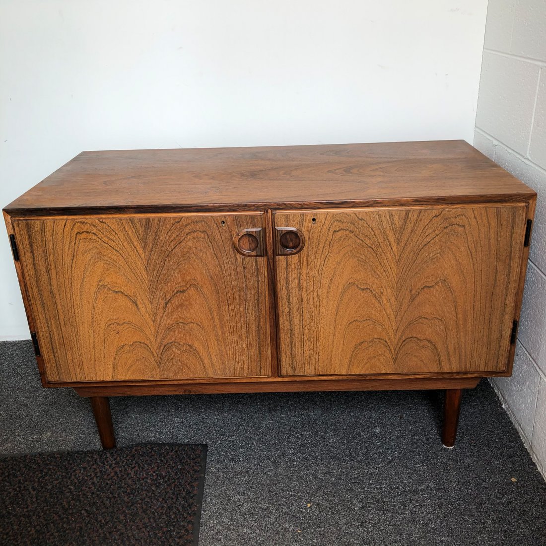 Rosewood 2 Dr, Credenza, Denmark: Rosewood 2 Dr, Credenza, Denmark, in its original finish possibly a lower cabinet for a larger system on tapered legs Measures 39.5" x 20" x 24"