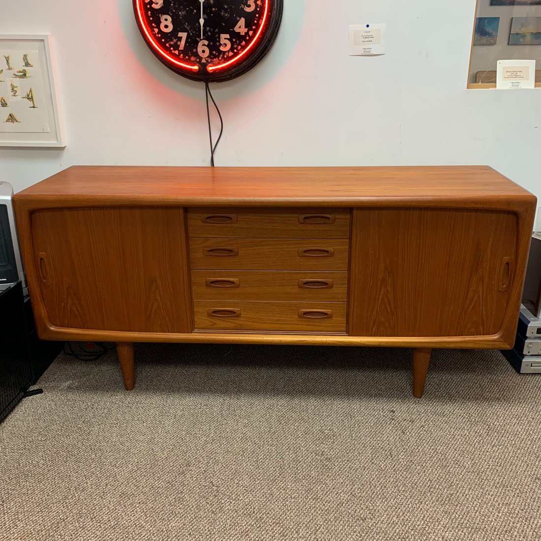 Sven Larsen Teak Credenza, Denmark: Sven Larsen Teak Credenza, Denmark, done in teak, c.1950's all original finish with sculptural detials ans fine sliding doors. This is a classic Measures 67" x 19" x 31"