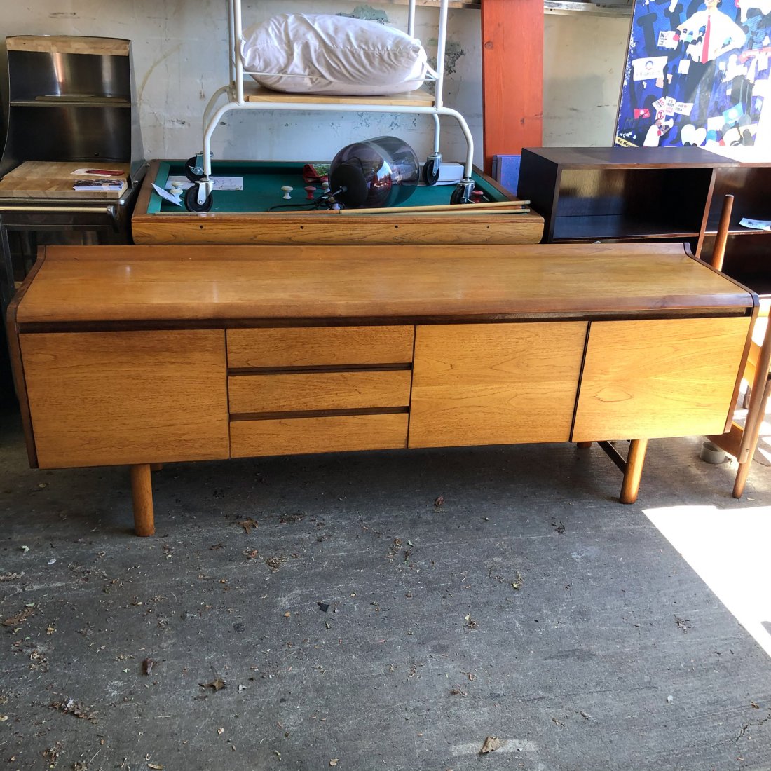White and Newton Credenza, UK: White and Newton Credenza, UK c. 1950's done in teak with mahogany interior. Features a drop down cocktail cabinet , 3 drawers and a double storage cabinet. Front has matched horizontal grain, All ori