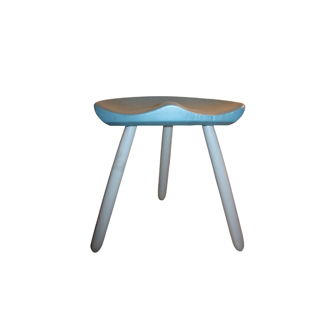 Tripod Milking Stool by Arne Olsen for Mogens Lassen: Tripod Milking Stool by Arne Olsen for Mogens Lassen First done in 1942 this simple classic has endured over the decades. Shown in its original light blue and crean finish Measures 21" x 15" x 19" SH:
