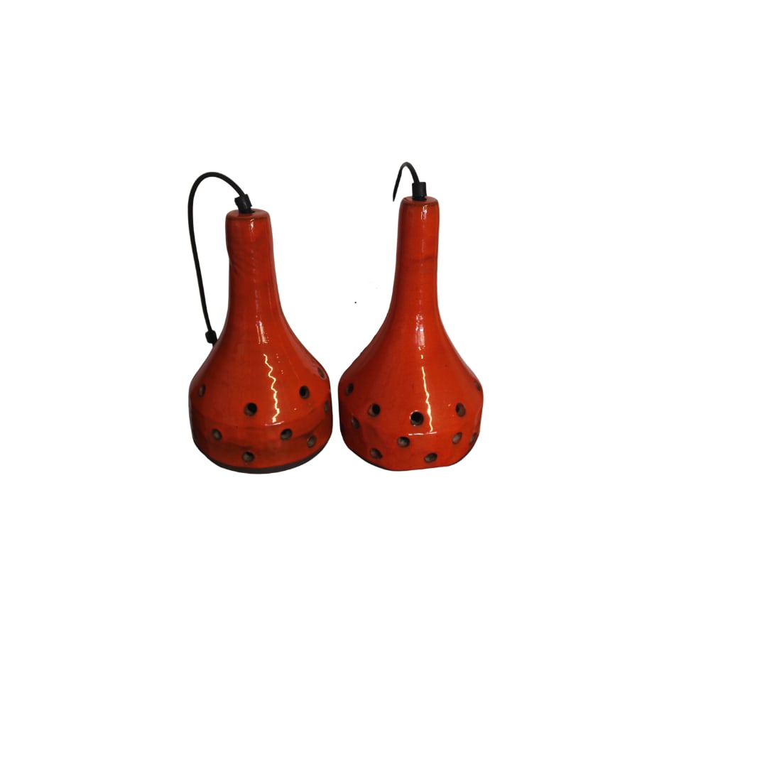 Pr of 1960s Ceramic Pendant, Netherlands: The pair of Ceramic Pendants from the Netherlands shown in classic Dutch color of Orange. Thick lava glaze and standard socket Condition is great Measures 9.5"h x 6" D