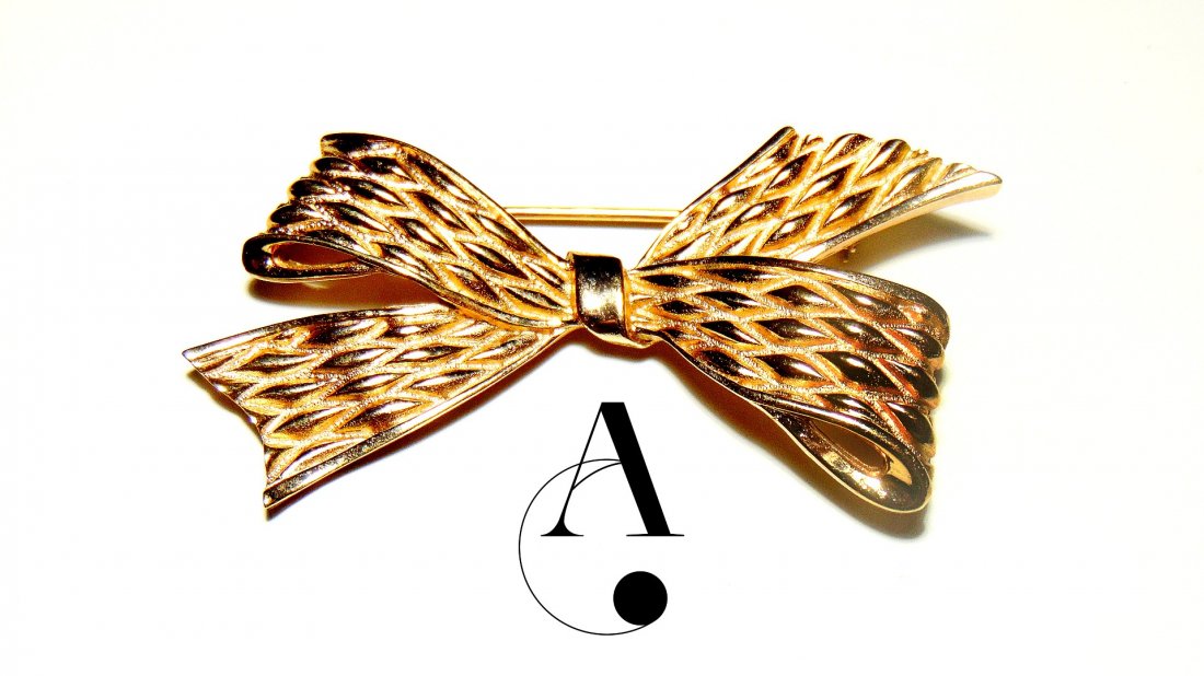 Vintage Brooch: TRIFARI - Bow: Collection: Vintage Collection / Trifari Gold-toned Bow / Height: 1.25 inches / Width: 2.5 inches / Weight: 15.5 grams