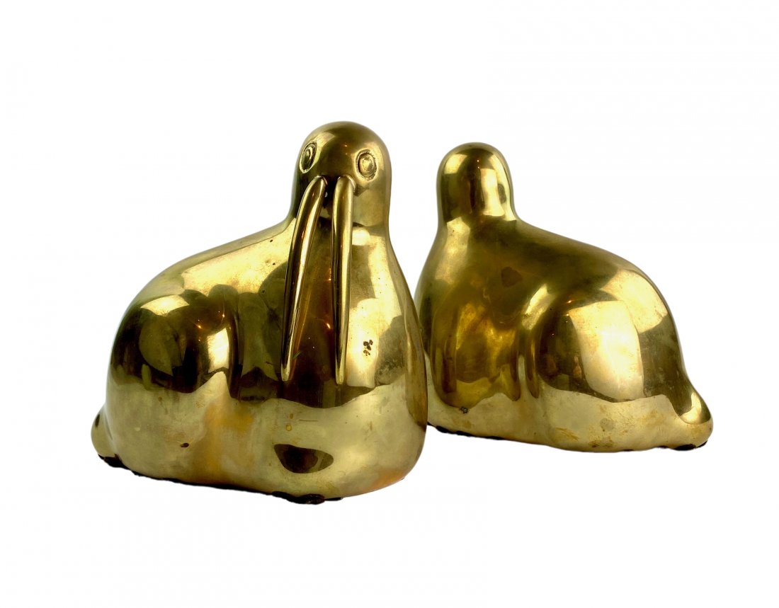 Vintage Dolbi Cashier Heavy Brass Walrus Bookends: 1980’s heavy brass modern walrus bookends by Dolbi Cashier. Measures 7 1/2ʺW × 4 3/4ʺD × 7 1/2ʺH.