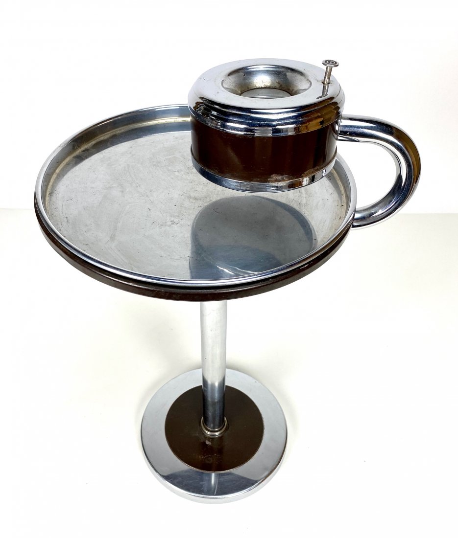 Art Deco Wolfgang Hoffmann by Howell Chrome Ash Stand: 1930's Art Deco chrome and dark brown enamel smoking stand by Wolfgang Hoffmann for Howell. The heavy base houses a rotating removable table with separate chrome tray and ashtray with functional push