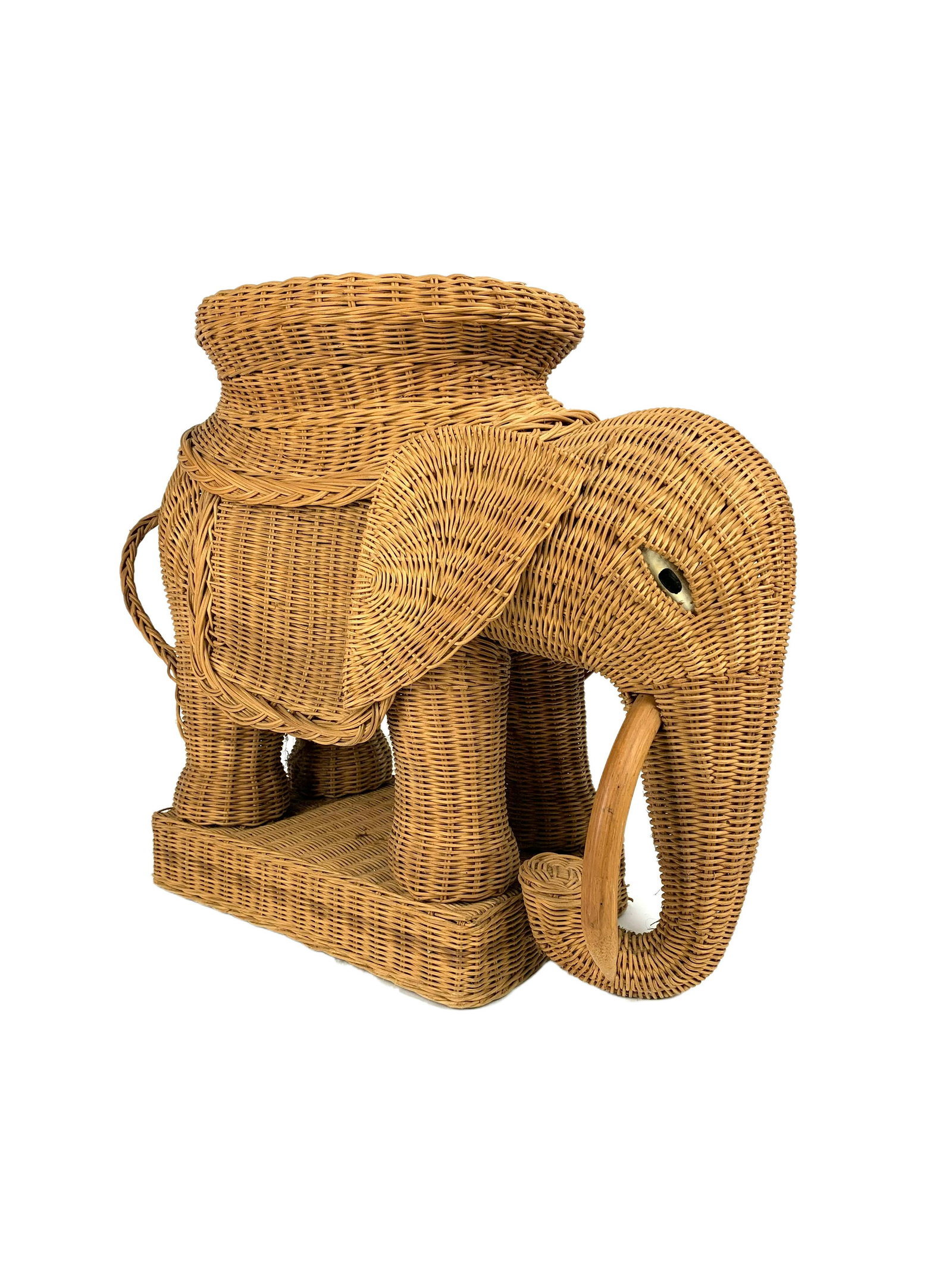 Mario Lopez Torres 1970's Rattan Elephant Stool: Unique vintage rattan elephant stool with wood eyes and tusks. Attributed to Mario Lopez Torres. Some light signs of edge wear but overall great condition. Measures at 20" x 25" x 10". Domestic in-hou