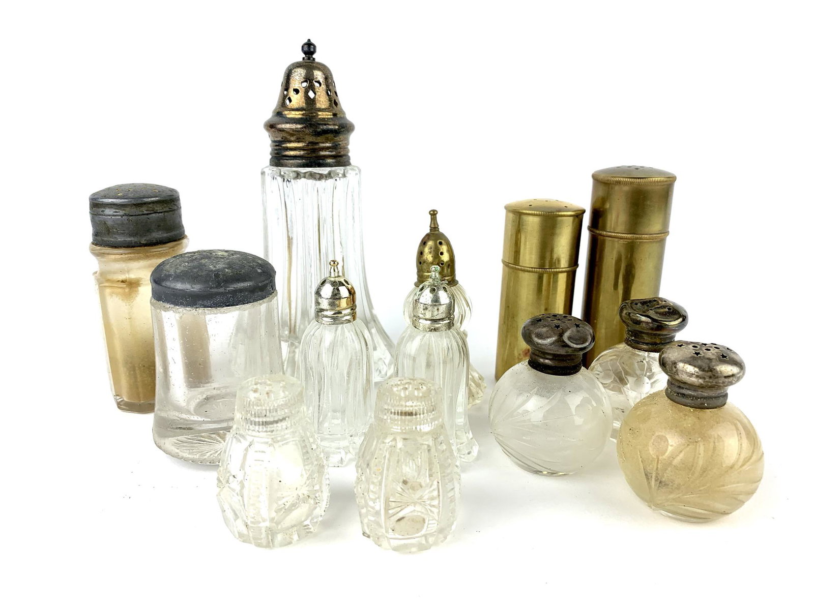 Antique Salt and Pepper Shakers Group: Group of 13 various antique glass and brass with some sterling tops. Measure 2" to 6".