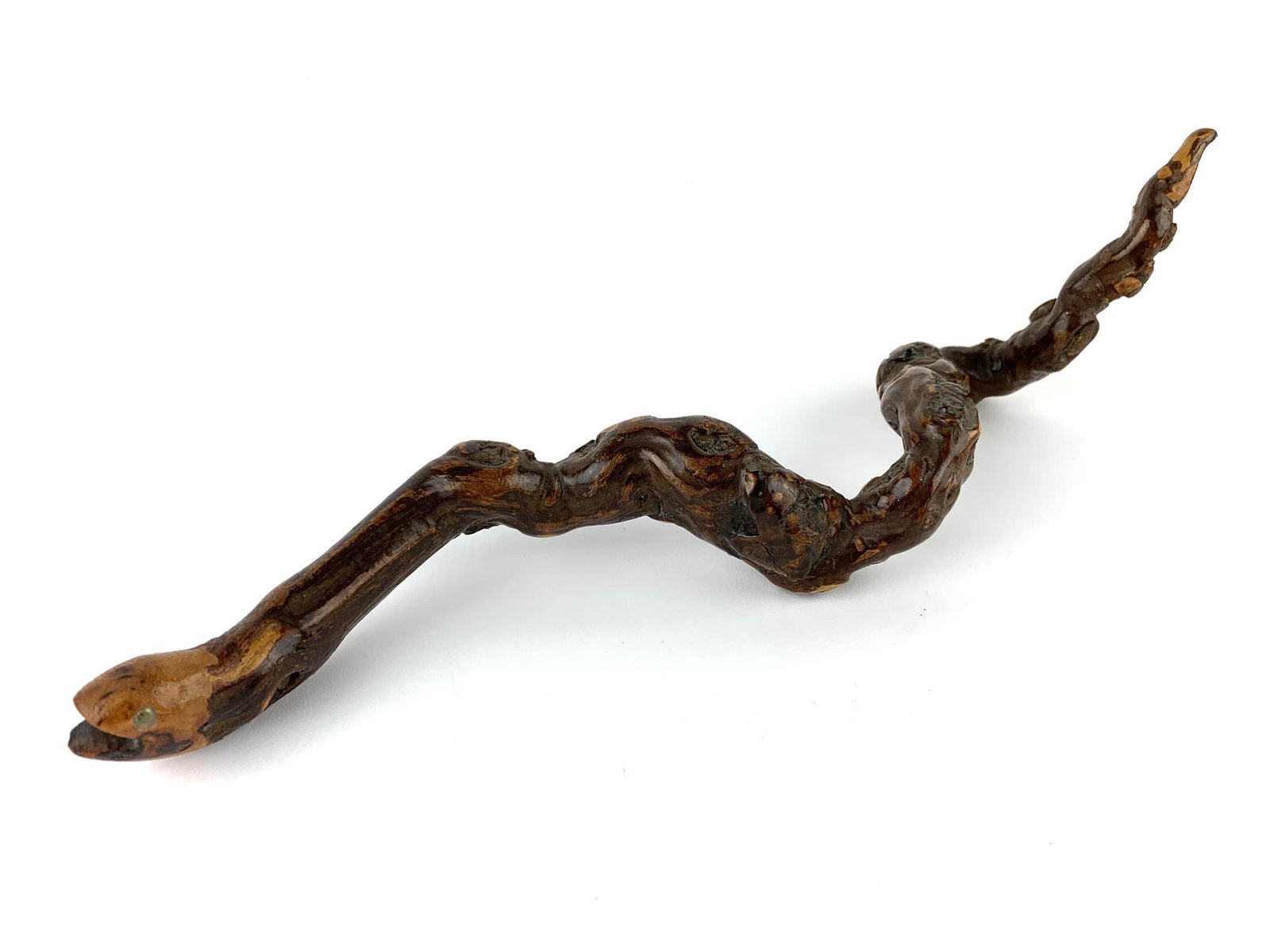 Folk Art Knotted Wood Carved Snake: Carved wood snake with painted eyes. Unknown maker. Measures 15" x 1 5/8" roughly.