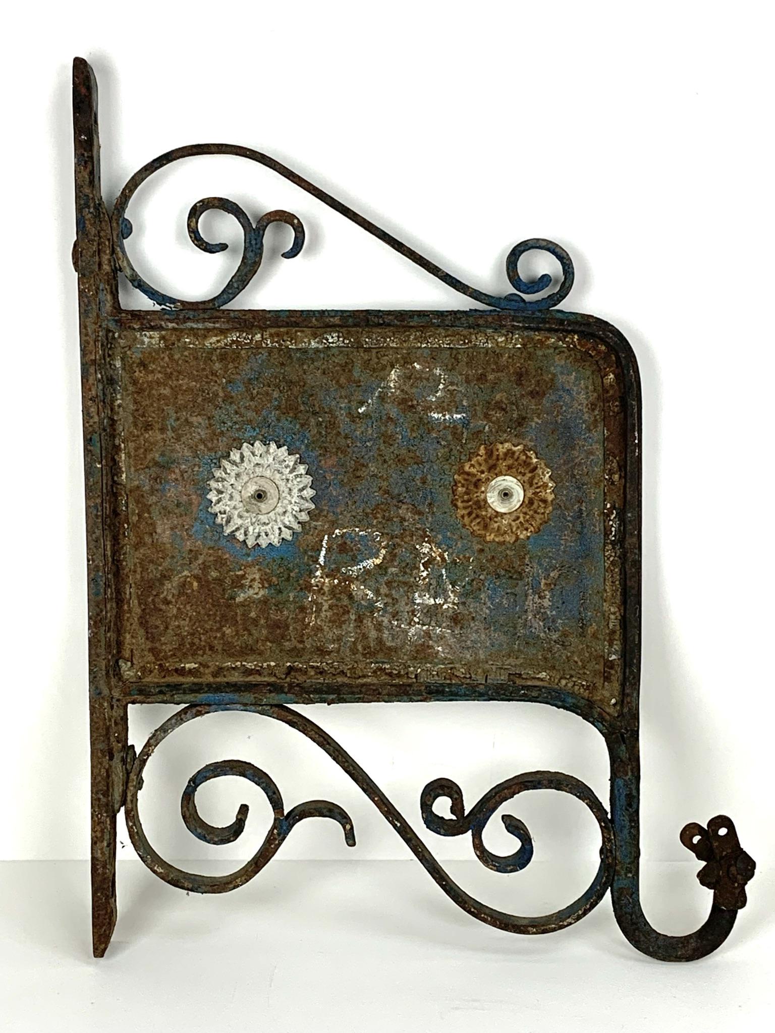 Antique Cast Iron Flange Shop Sign: Measures 22 3/4" x 17". Old wrought Iron hanging shop sign.