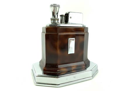 Ronson Touch Tip Stepped Chrome Table Lighter: Chrome and Faux Tortoise Ronson touch-tip table lighter as-is. Measures about 3 3/4" x 3 3/4"