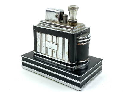 Art Deco Ronson Chrome Table Lighter: Stepped chrome and black metal enamel art deco table lighter by Ronson. Measures about 3 3/4" x 3 3/4 x 2 1/4"