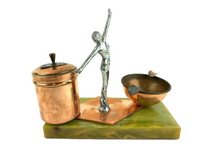 1933 Art Deco World's Fair Woman Ashtray Stand: Chicago World's Fair Art Deco woman figure copper and Bakelite ashtray desk stand. Measures 7" x 7 1/2" x 3 3/4"