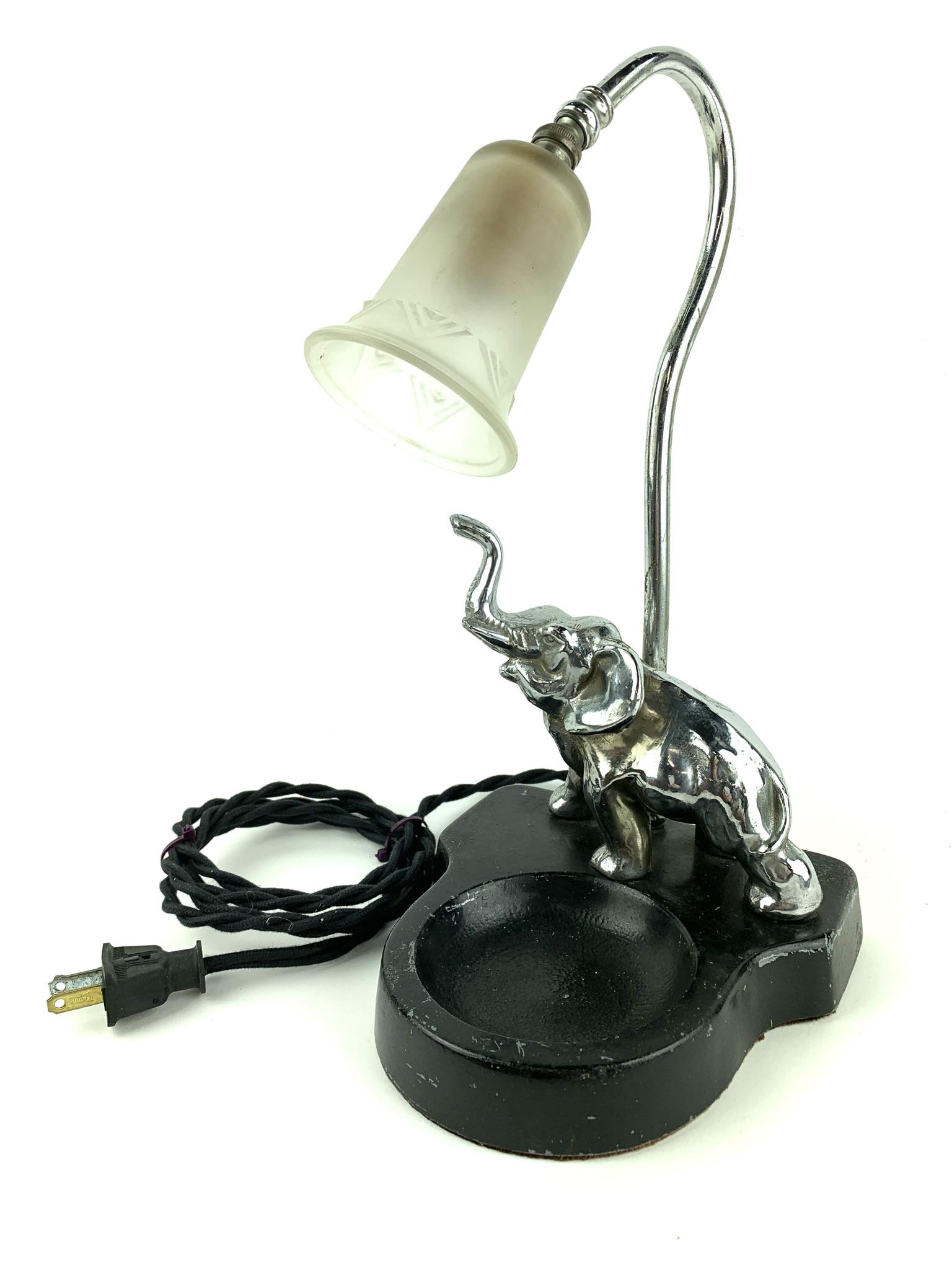 Art Deco Elephant Lamp Ashtray: Pot metal & Nickel Elephant goose neck night stand lamp ashtray by unknown maker. Measures 13" X 6" X 6 1/2".