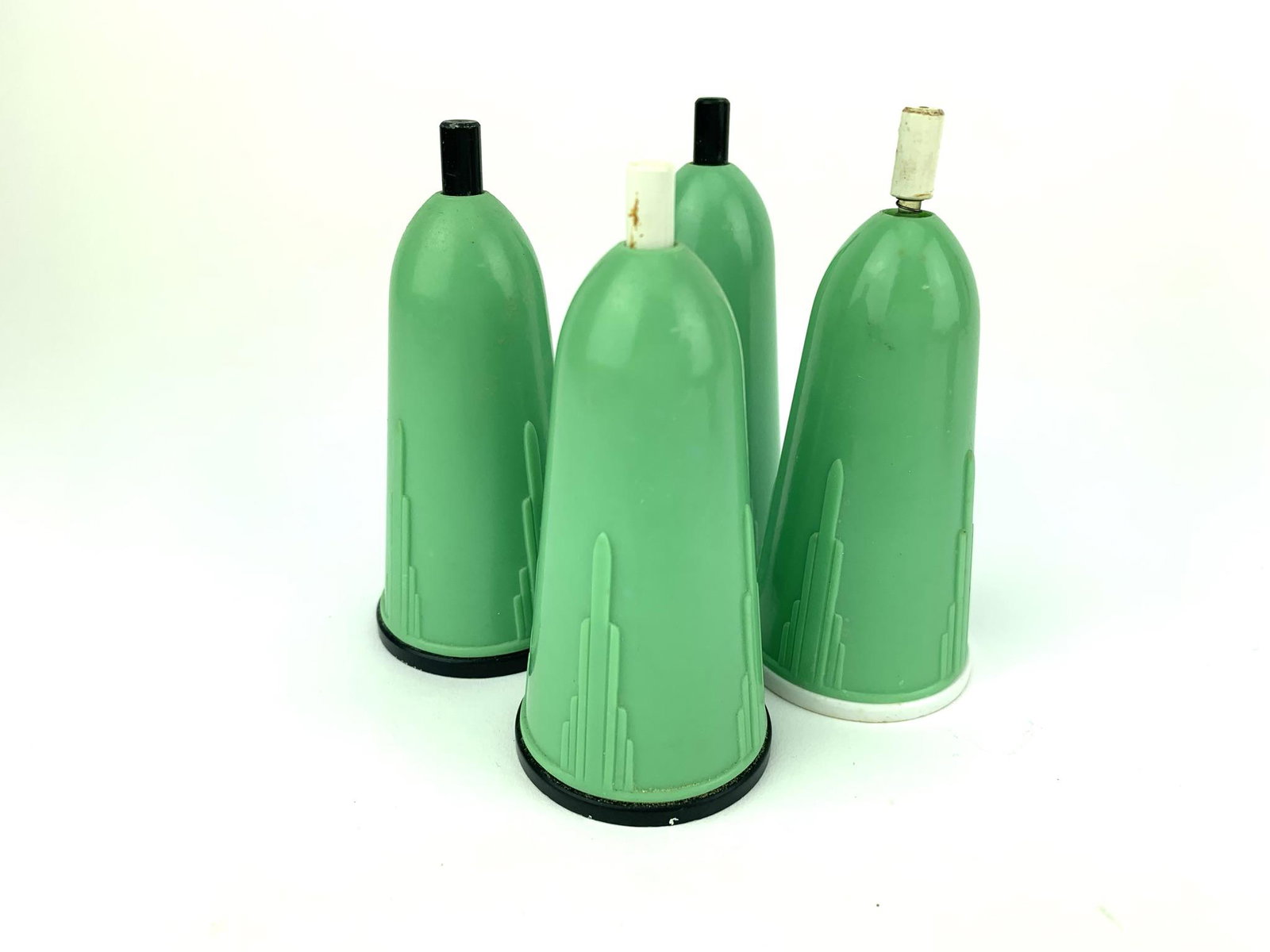 Art Deco Sonettes Push Button Salt & Pepper Dispensers: 4 matte green hard plastic art deco push button salt and pepper shakers. Marked Sonettes on bottom. Measure 3 1/2" x 1 1/2"