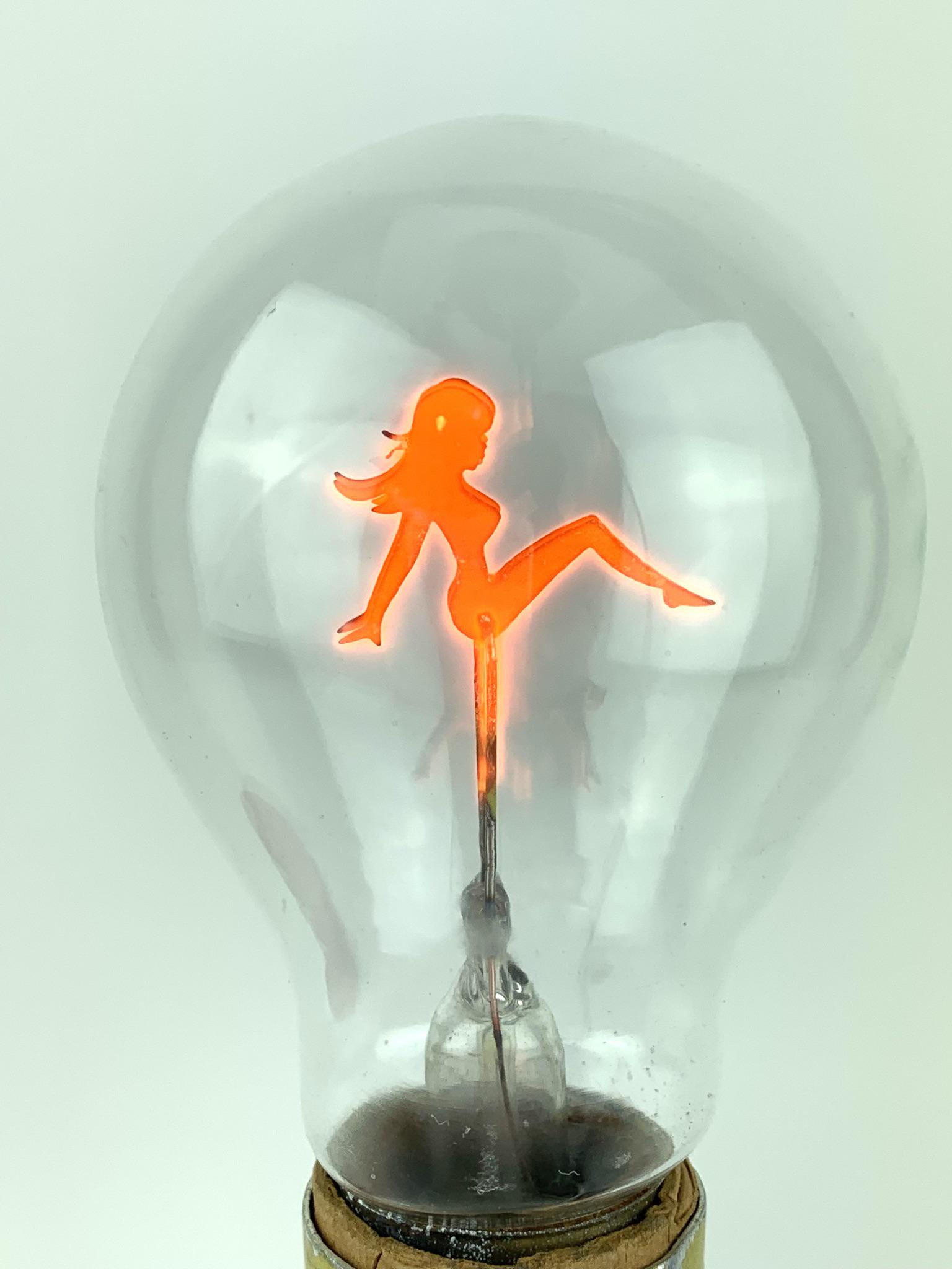 Vintage Nude Lady Silhouette Light Bulb: Standard size reclining nude lady silhouette light bulb. Unknown maker.