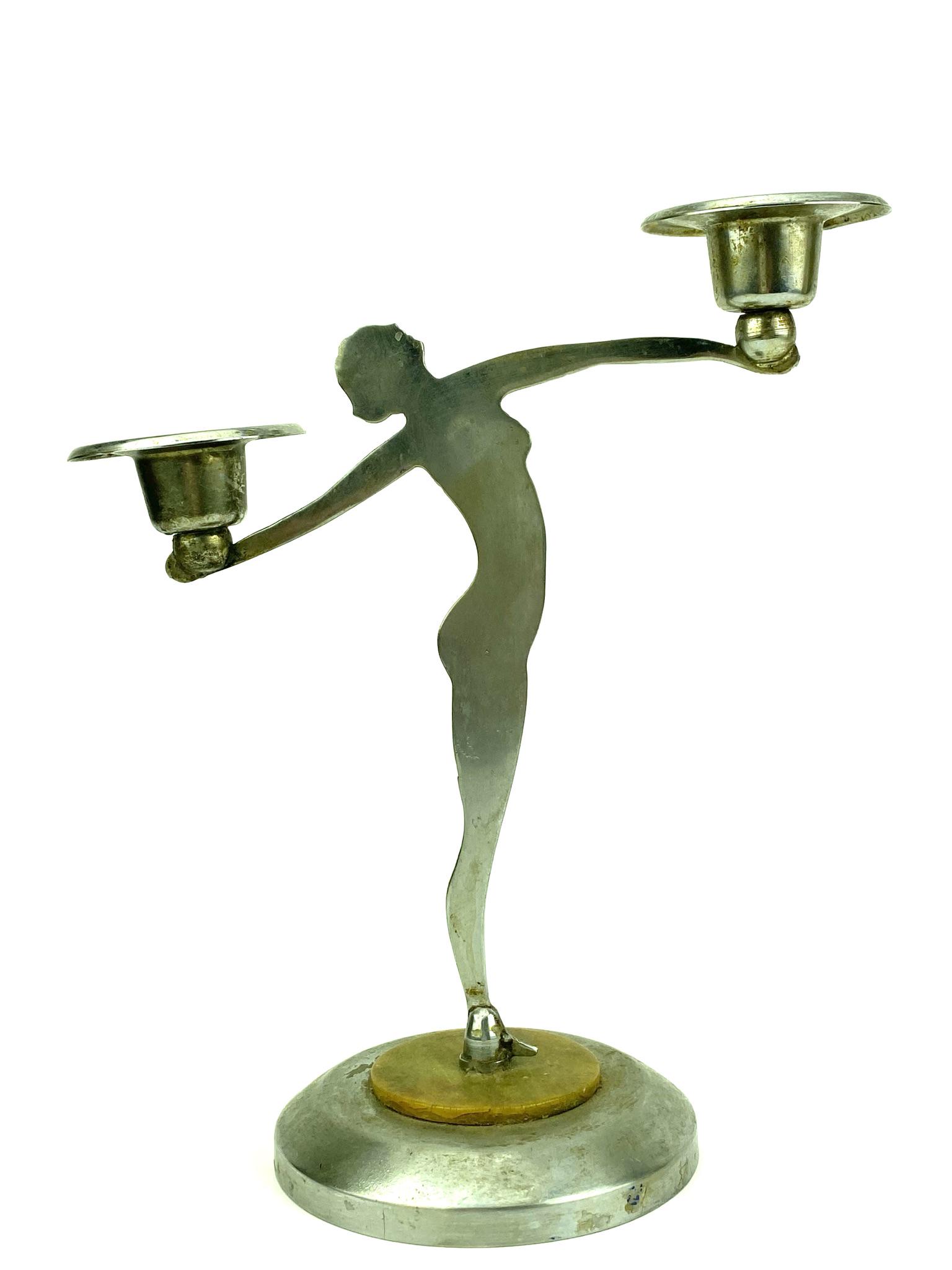 Art Deco Chrome Nude Woman Candle Holder: Chrome with weighted base nude woman silhouette candle holder by unknown maker or designer. Measures 9" x 7 3/4"