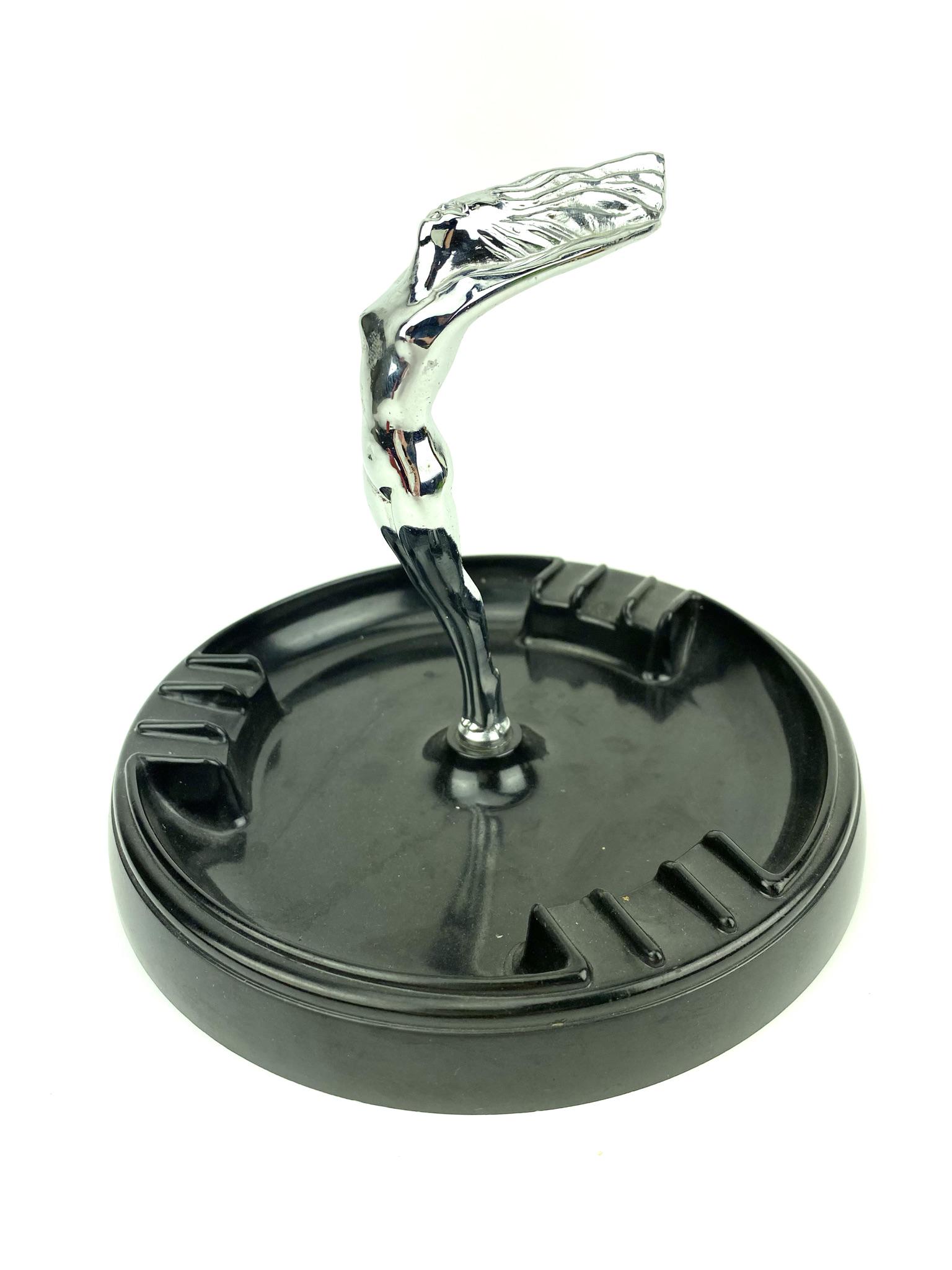 Vintage Flying Nude Art Deco Ashtray: Chrome flying nude figure in center with molded plastic tray base. Stamped 980 Statuette Harry Davies Molding Co. Measures 6 1/4" x 7"
