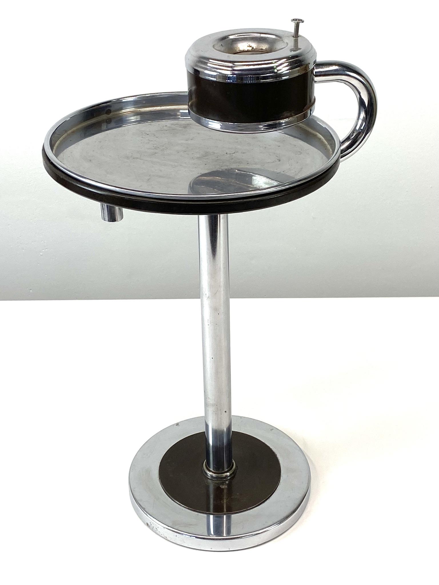 Art Deco Wolfgang Hoffmann Howell Chrome Ashtray Stand Table: 1930's Art Deco chrome and dark brown enamel smoking stand by Wolfgang Hoffmann for Howell. The heavy base houses a rotating removable table with separate chrome tray and ashtray with functional push