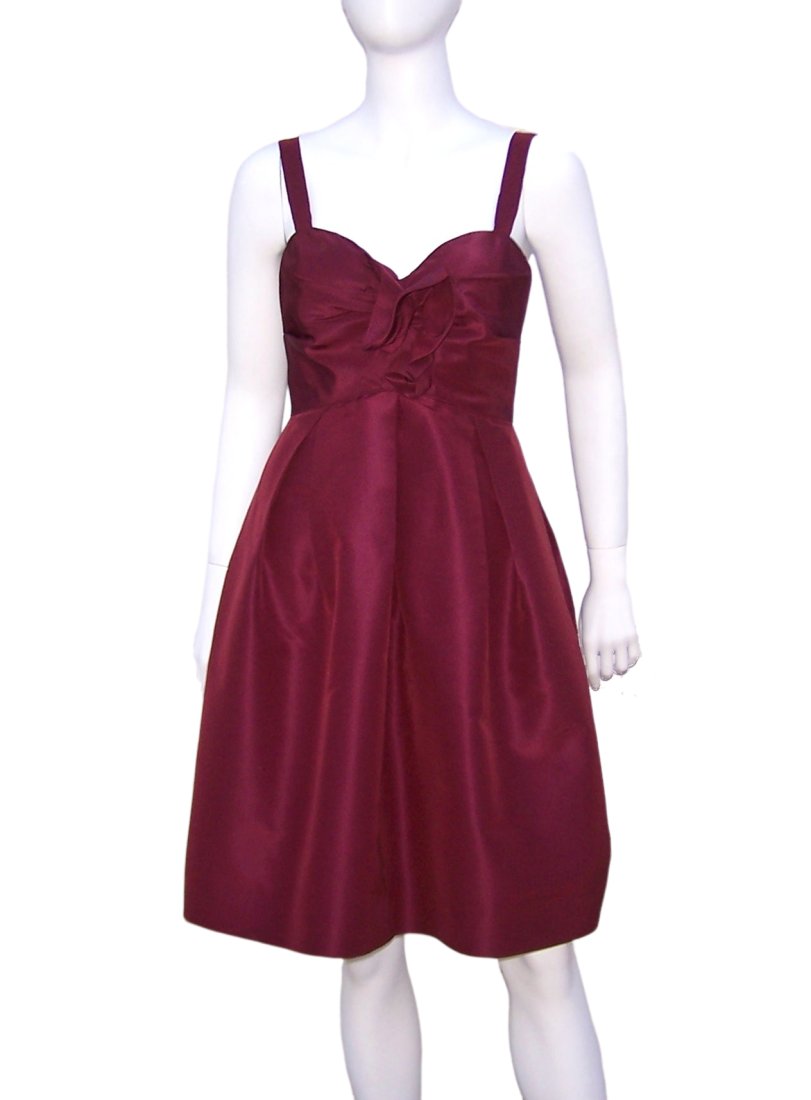 Oscar de la Renta Aubergine Silk Taffeta Dress C.2000: Oscar de la Renta aubergine silk taffeta dress with ruching at the bust and inverted pleating at the skirt which creates a bubble effect. It zips and hooks at the back with boning at the side of the b
