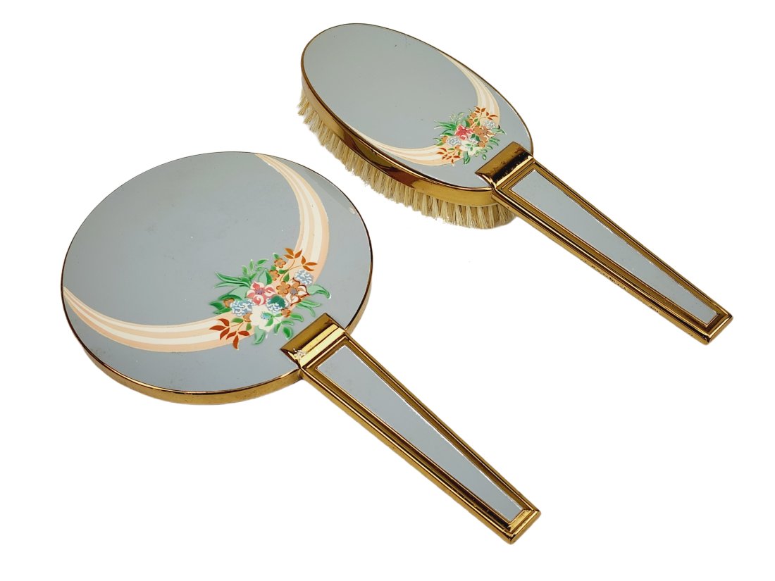 Antique Victorian Elgin Gold Tone Enamel Brush & Mirror: Antique brush and mirror stamped Elgin with gold tone trim and flower enamel pattern. Measures 8 1/2" x 4 1/2" mirror & 8 1/4" x 2" brush.