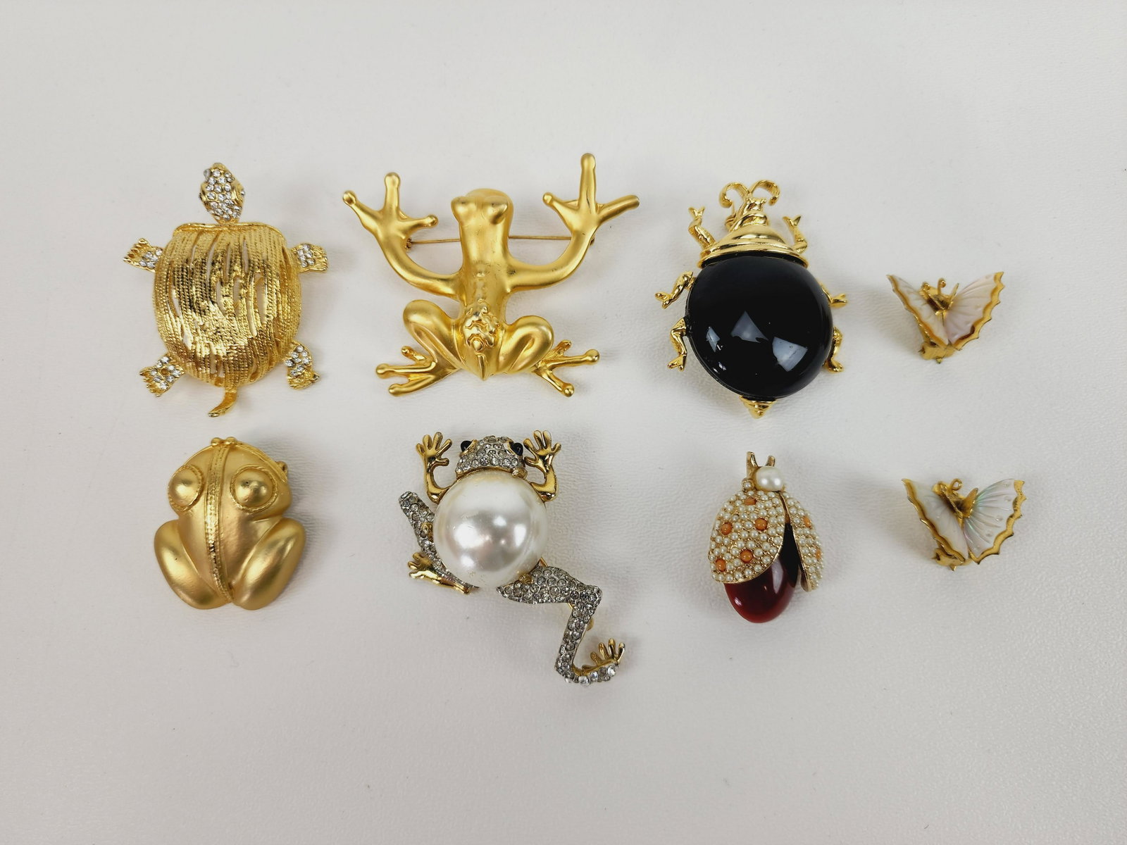 Vintage Frog, Turtle & Beetle Brooch Lot w/ Butterfly Earrings: Group of 7 Mid Century bugs and amphibian costume jewelry. Unknown maker or designers. Measure 3/4" to 2 1/2"