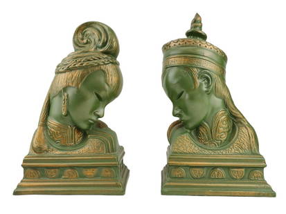 1950's Asian Mid Century Ceramic Bust Bookends: Pair of green and gold painted ceramic busts of an Asian man and woman. Unknown maker or designer. Measure 13 1/2" to 14 1/4" tall x 8" wide x 6" deep.