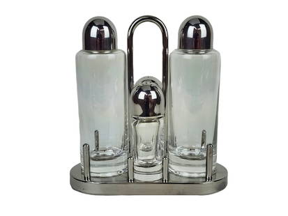 Ettore Sottsass Design Alessi Condiment Set: Stainless and glass 5pc condiment set designed by Ettore Sottsass for Alessi. Measures 7 1/2" x 7" x 3" total with 4 1/4" salt and pepper shakers.