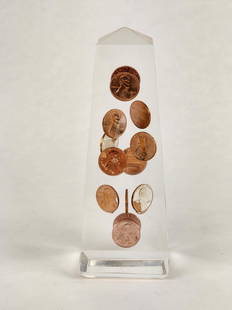 Vintage Lucite Pennies 1974 Obelisk Sculpture: Lucite obelisk sculpture with 14 1974 pennies floating inside. Measures 6 3/4" x 2 1/2"