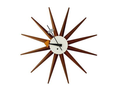 George Nelson Howard Miller Sunburst Spoke Clock: White with walnut wood spindles sunburst spoke clock designed by George Nelson for Howard Miller. Measures 18 3/4" x 3 1/4" deep.