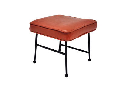 Vintage Mid Century Iron Base Orange Footstool: Vintage black metal iron base footstool with orange vinyl cushion. Unknown maker. Measures 12" x 13 1/2" with 2 1/2" cushion.