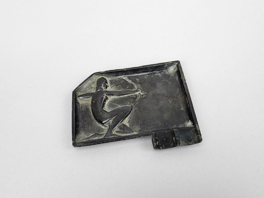 Antique Copper Female Huntress Art Deco Ashtray: Antique copper with bronze wash art deco ashtray made in Yugoslavia. Depicts a raised relief nude female hunter. Measures 3 1/2" x 3".