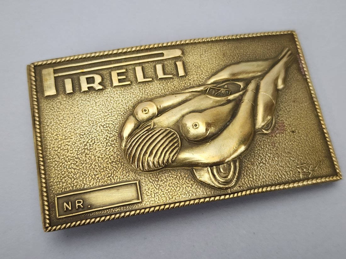 Salvador Dali Pirelli Brass Belt Buckle: Vintage Art Deco Salvador Dali for Pirelli stylized brass belt buckle. Stamped on backside with in plate signature on front. Measures 1 3/4" x 3".