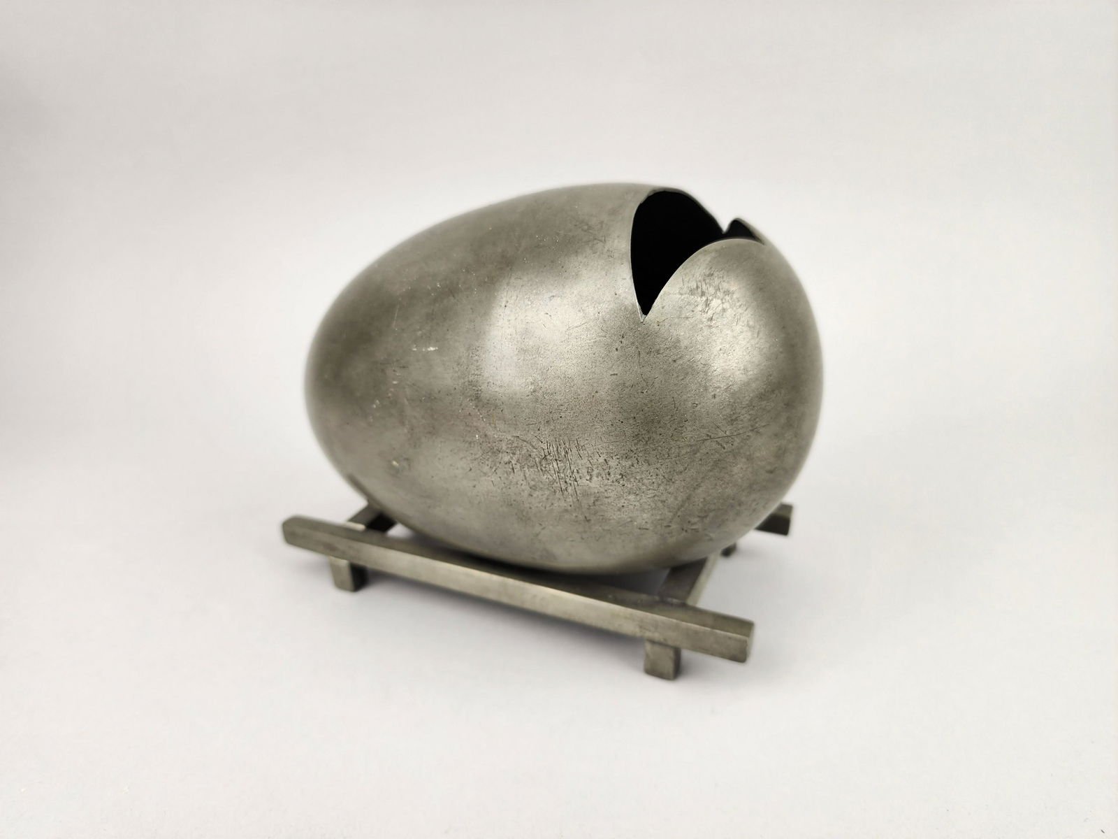 1917 AB Hallmarks Pewter Egg Sculpture: Vintage egg in pewter with AB hallmarks. Measures 5" x 6 1/2" x 4 1/2"