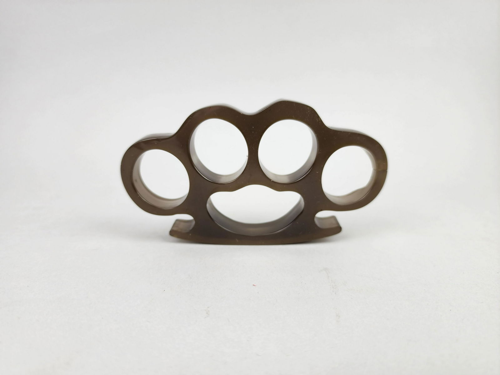 Vintage Acrylic Brass Knuckles: Unique pair of Lucite knuckles by unknown maker or manufacturer. Measure 3 1/2" x 4 1/2" x 1/2".