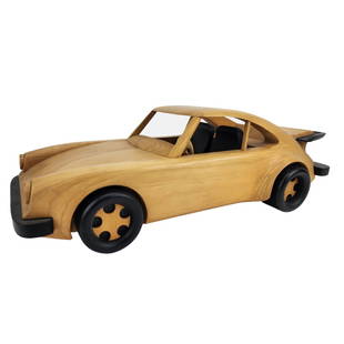 Large Porsche 911 Coupe Wood Carved Sculpture Model: Vintage wood carved Porsche 911 Carrera Coupe with black painted wood bumper, fin, tires and seats. Measures 6" x 19" x 9 1/2".