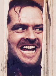 Jack Nicholson Signed Stock Photo "The Shining" Movie: Vintage "The Shining" by Stephen King stock movie photo of Jack Nicholson signed in marker lower right, framed and matted. Measures 12 1/2" x 15 1/2" with 7 3/4" x 9 3/4" matted window with wood frame