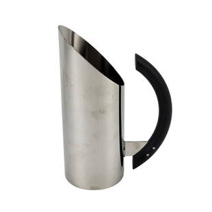 MARIO BOTTA for Alessi "Tua" Pitcher: Italian modernist stainless steel pitcher by Mario Botta for Alessi dubbed the "Tua" pitcher. Stamped on bottom. Measures 9 1/2" x 6 1/2" x 3 1/2".