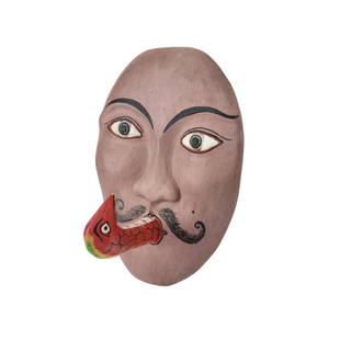 Vintage Mexican Folk Art Wall Sculpture Mask: Vintage Mexican Folk Art wall mask depicting a man with a bird for a tongue. Would make a great hat or cane hook. Measures 9" tall x 6 1/2" wide x 4 1/2" deep