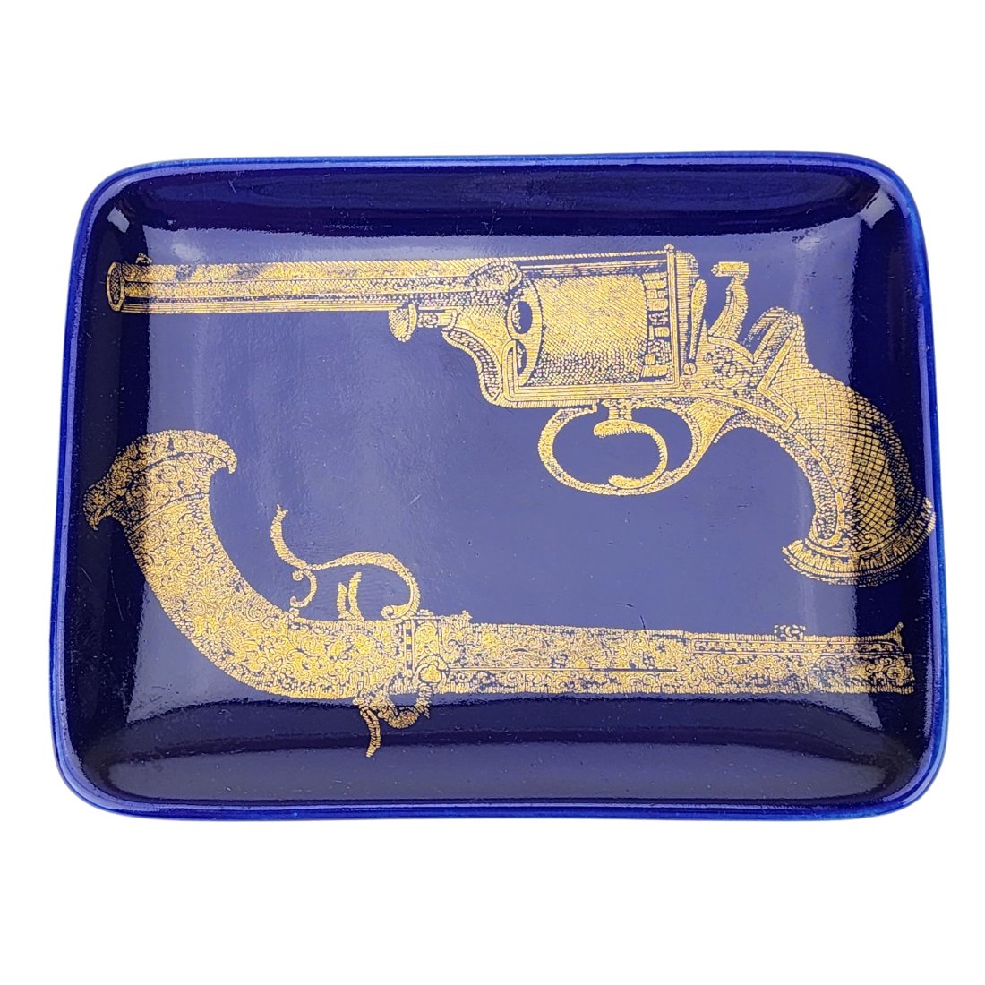 Fornasetti Ceramic Porcelain Antique Gun Revolver Tray: Cobalt blue glaze ceramic porcelain Italian art tray with gold leaf antique revolvers by Fornasetti. Stamped on bottom. 4 1/4" x 5 5/8"