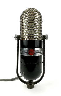 Vintage RCA 77 Ribbon Microphone Pill Capsule: Rare 1940's ribbon microphone by RCA. Original condition with replacement yoke off a different 77 microphone. The original chrome yoke will be included but it is damaged. Measures 9"t x 3.5"w x 2.75"d