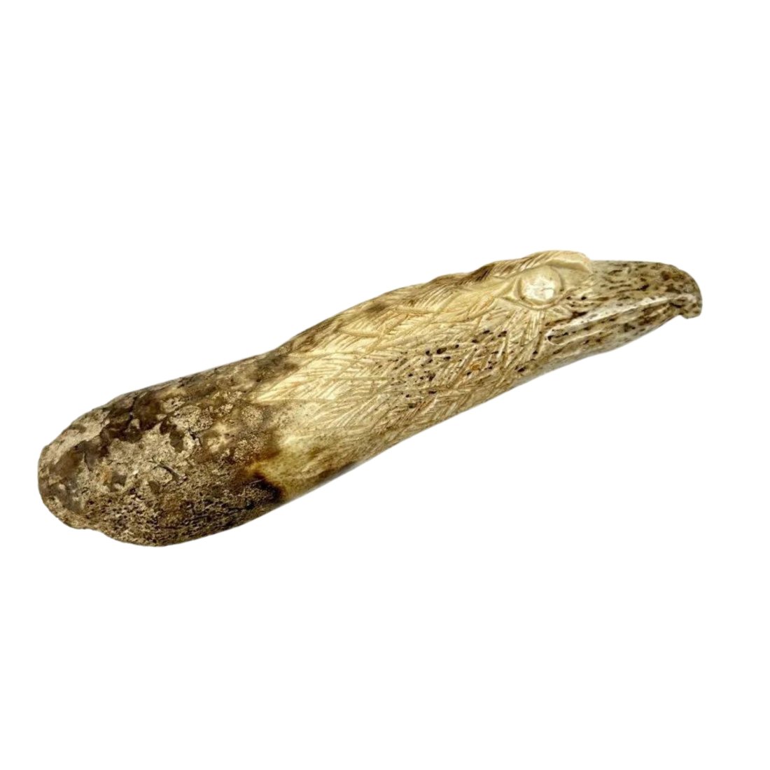 Inuit Alaskan Carved Fossilized Bone Eagle Oosik: Inuit carved eagle Oosik (walrus penile bone). Measures 7"l x 1.75"w x 1.75"d. Unsigned.