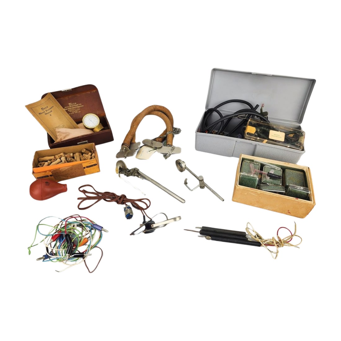 Antique Early Lie Detection Polygraphy Machine Parts & Accessories: Antique early lie detection parts and accessories including: Pneumograph Sumner's intact hoses with metal end plates by C.H. Stoelting, 1930's. 51 wooden mouthpieces for spirometer by C.H. Stoelting, 