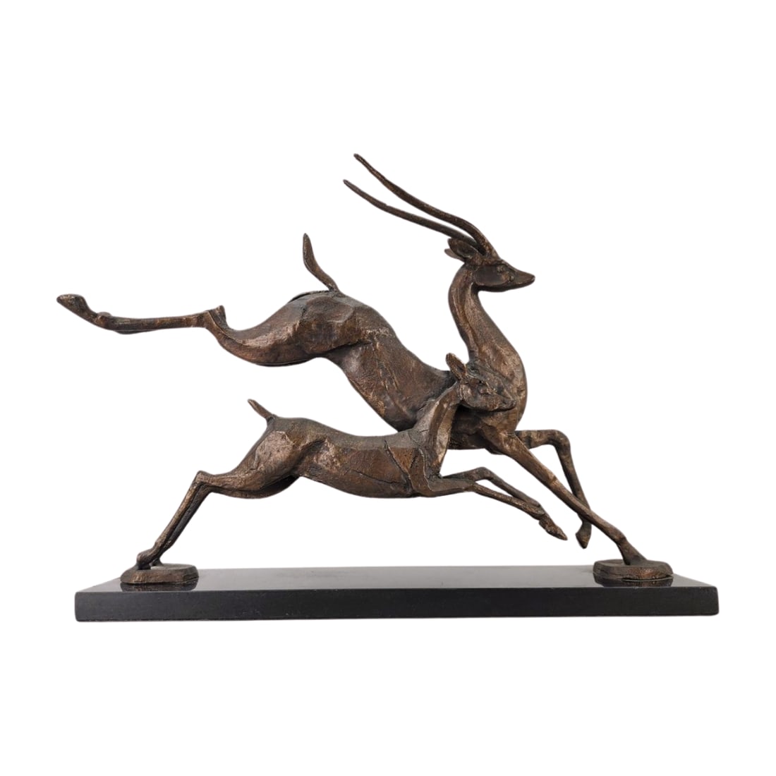 Art Deco Style Bronze Running Antelope Sculpture: Bronze Antelopes running sculpture in an art deco style on stone base. Measures 12 1/2" x 15 3/4" x 4".