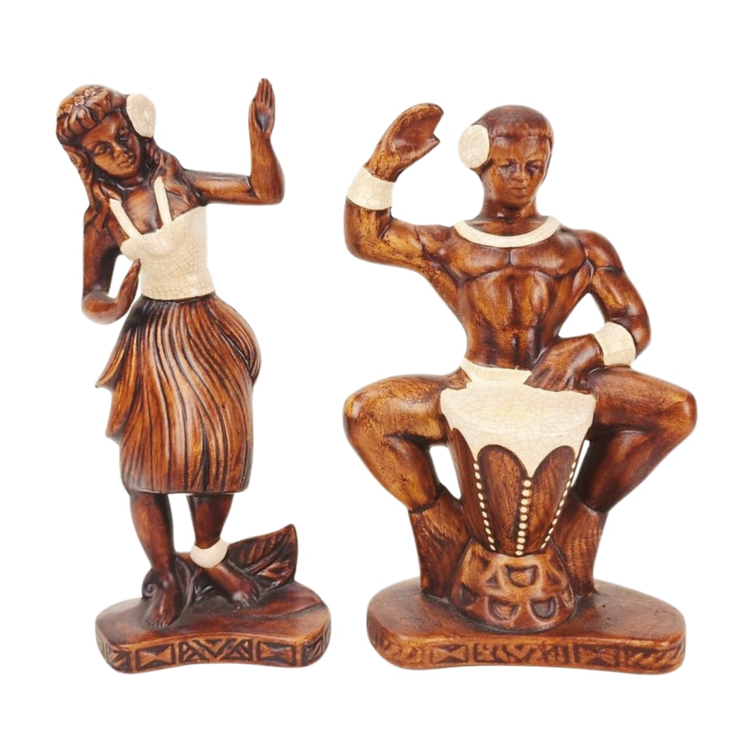 Mid Century Treasure Craft Hula Dancer & Drummer Ceramic Statues: Pair of Treasure Craft of Hawaii ceramic statues depicting a Hula Dancer and Drummer. Stamped on backside. Measure about 6" x 11" each.