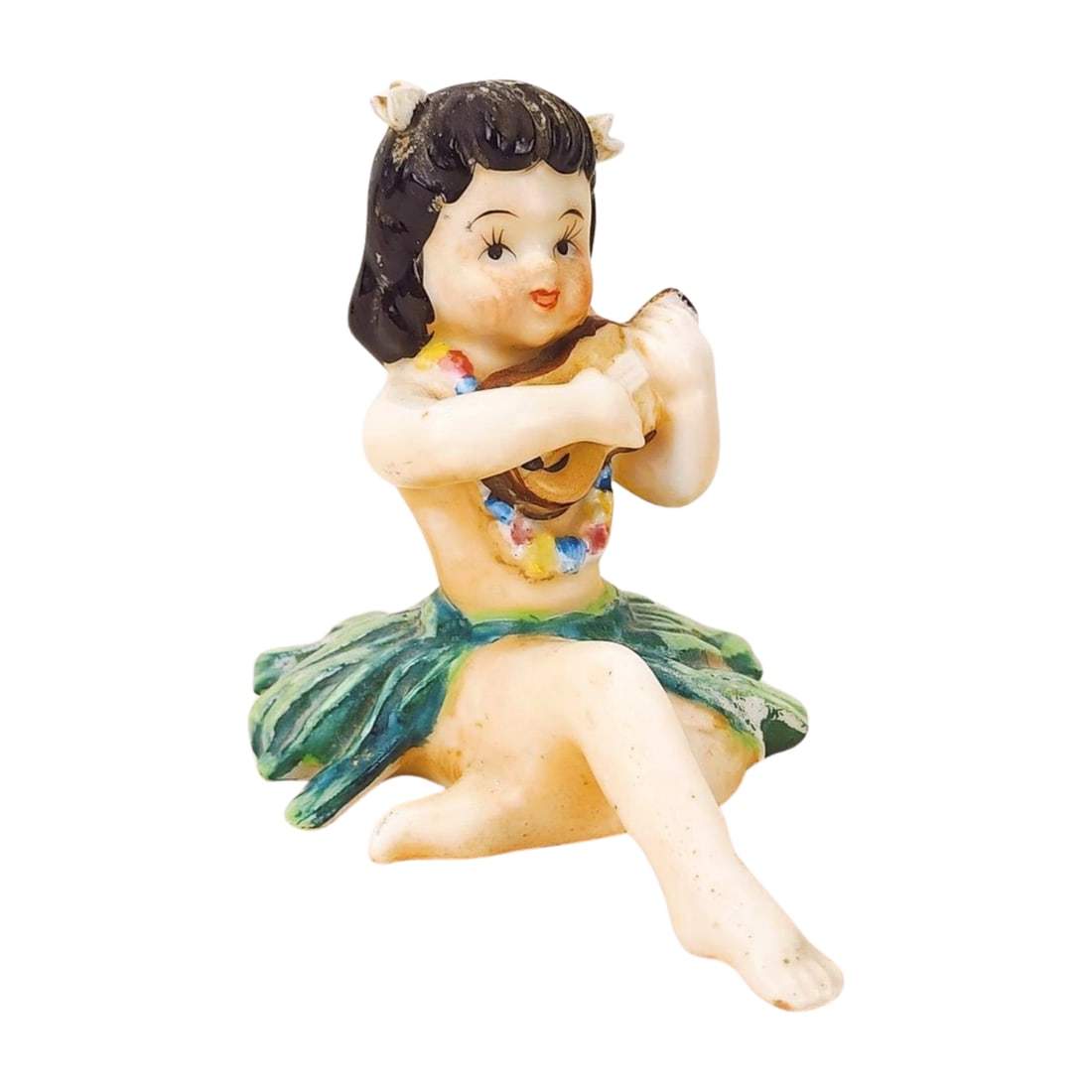 Vintage Ceramic Bisque Hula Girl Figurine: Vintage sitting hula girl ceramic bisque figure possibly from Japan. Measures 3 1/2" x 2 1/2" x 4".
